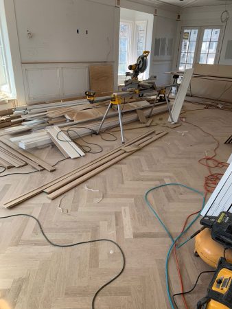 custom herringbone hardwood floor installation - in progress