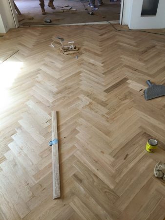 custom herringbone hardwood floor installation