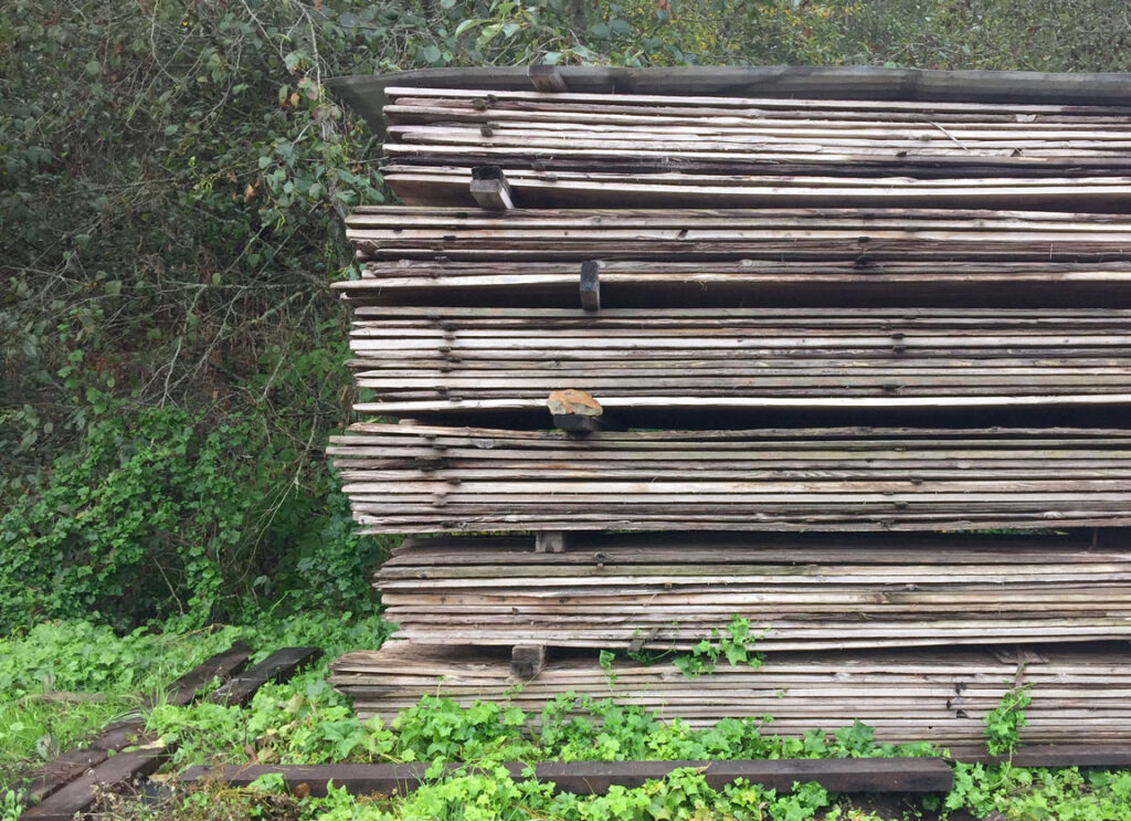 reclaimed wood in a pile outside