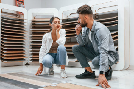 man and woman with floor samples