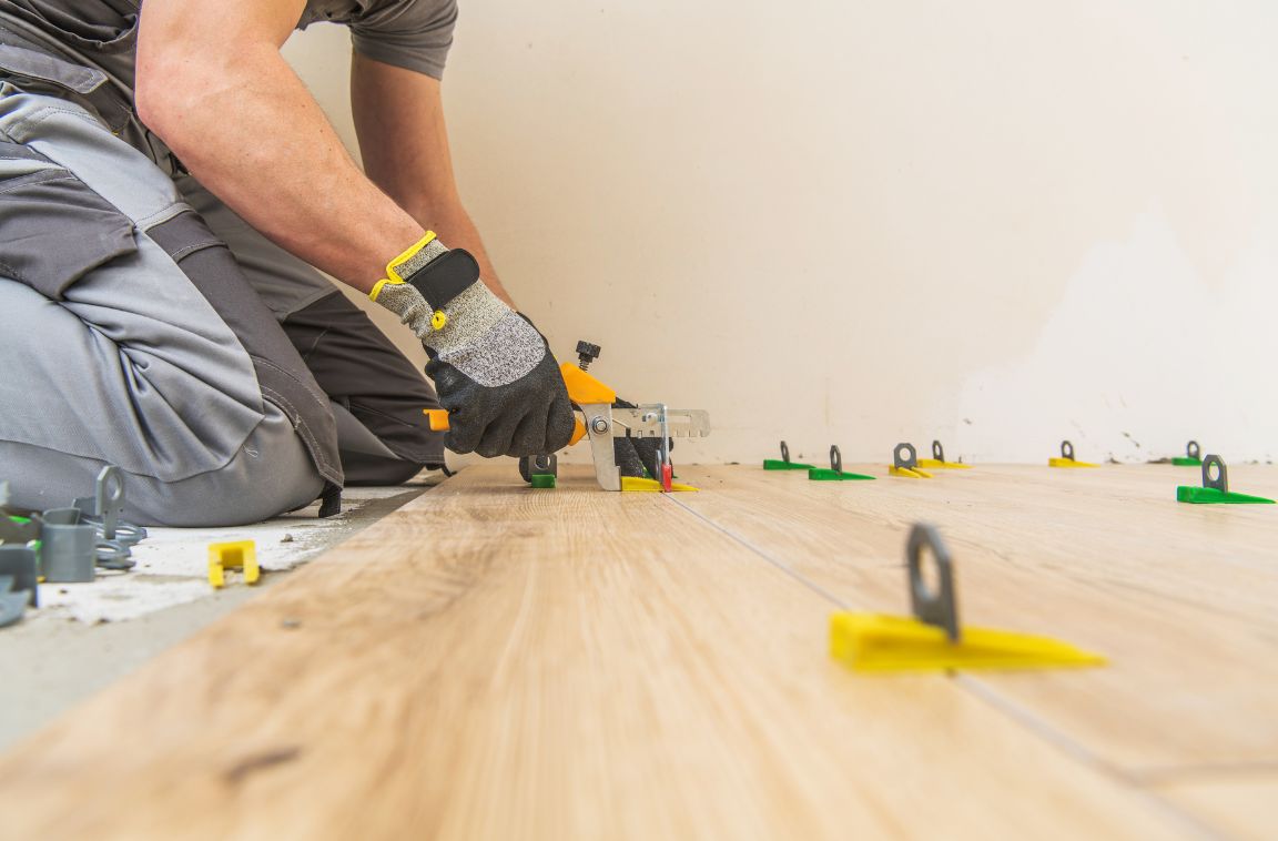 professional installing a floor in a room