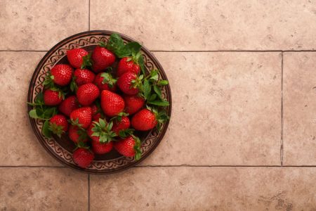 EMF Feature fresh-strawberries-in-bowl-on-tan-tiled-surface-2026-01-09-07-40-32-utc Tan tile floor