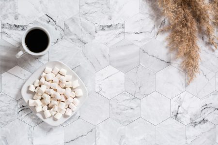 EMF Feature marshmallows-and-coffee-on-marble-hexagon-tiles-2026-03-19-03-10-43-utc hexagon tile floor