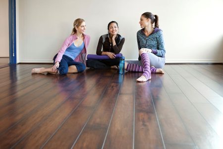 EMF Blog 1 three-friends-sharing-a-relaxed-moment-on-a-yoga-s-2026-03-25-02-27-47-utc Friends on floor