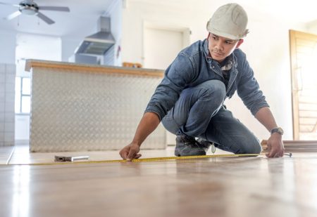 EMF Feature 2man-measures-flooring-in-home-renovation-project-2026-03-25-08-23-12-utc Man measuring floor