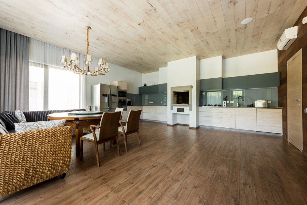 interior-view-of-stylish-empty-kitchen-and-dining laminate flooring in home kitchen
